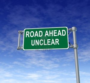11405182-road-ahead-unclear-green-freeway-sign-representing-uncertainty-in-financial-business